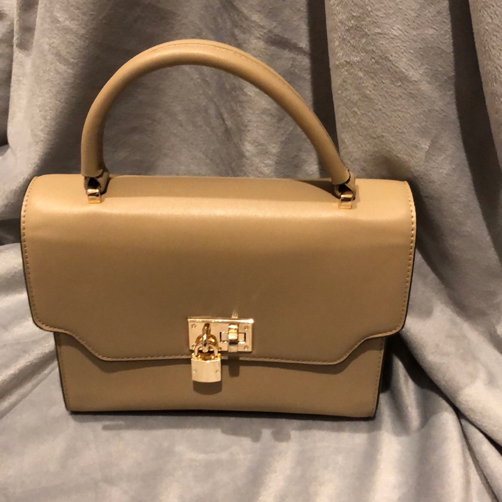 Cute beige handbag with lock